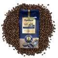 Kafie 1901 Honduras Organic Coffee 1 lb whole bean bag on a pile of roasted coffee beans