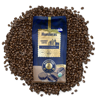 Kafie 1901 Honduras Organic Coffee 1 lb whole bean bag on a pile of roasted coffee beans