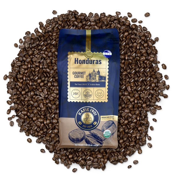Kafie 1901 Honduras Organic Coffee 1 lb whole bean bag on a pile of roasted coffee beans