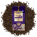 Kafie 1901 Italian Espresso Roast Organic Coffee 1 lb whole bean bag on a pile of roasted coffee beans